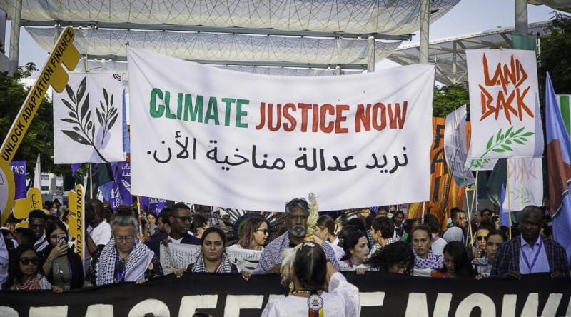 Protest at COP28, Dubai, demanding Climate Justice Now