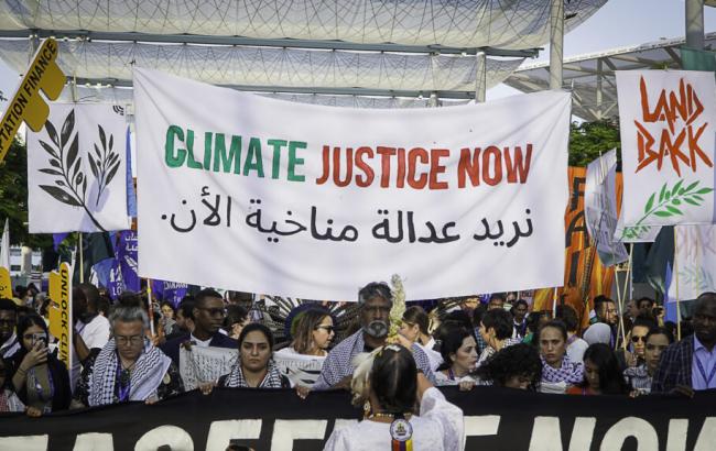 Protest at COP28, Dubai, demanding Climate Justice Now